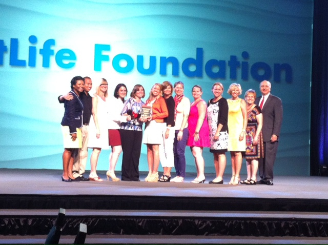 The Junior Achievement-Rocky Mountain, Inc. team accepts their MetLife Foundation Award