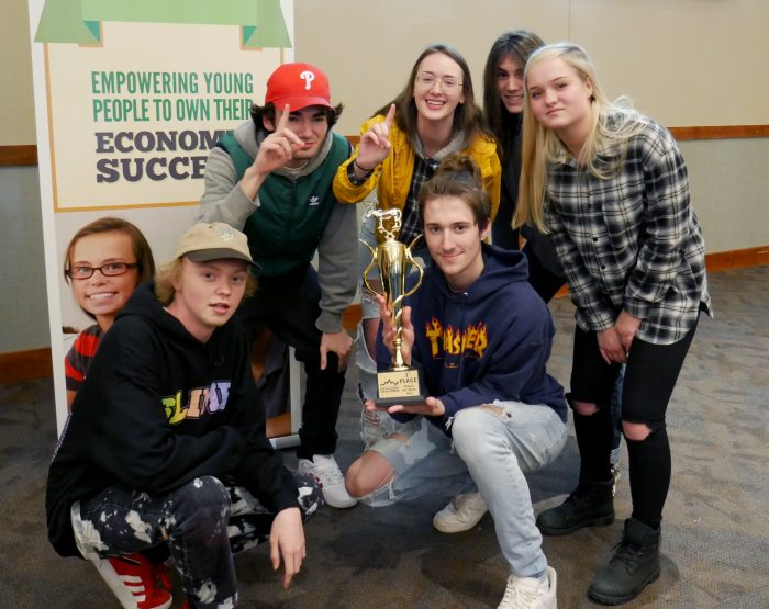 Centennial High School students with trophy at Junior Achievement Stock Market Challenge